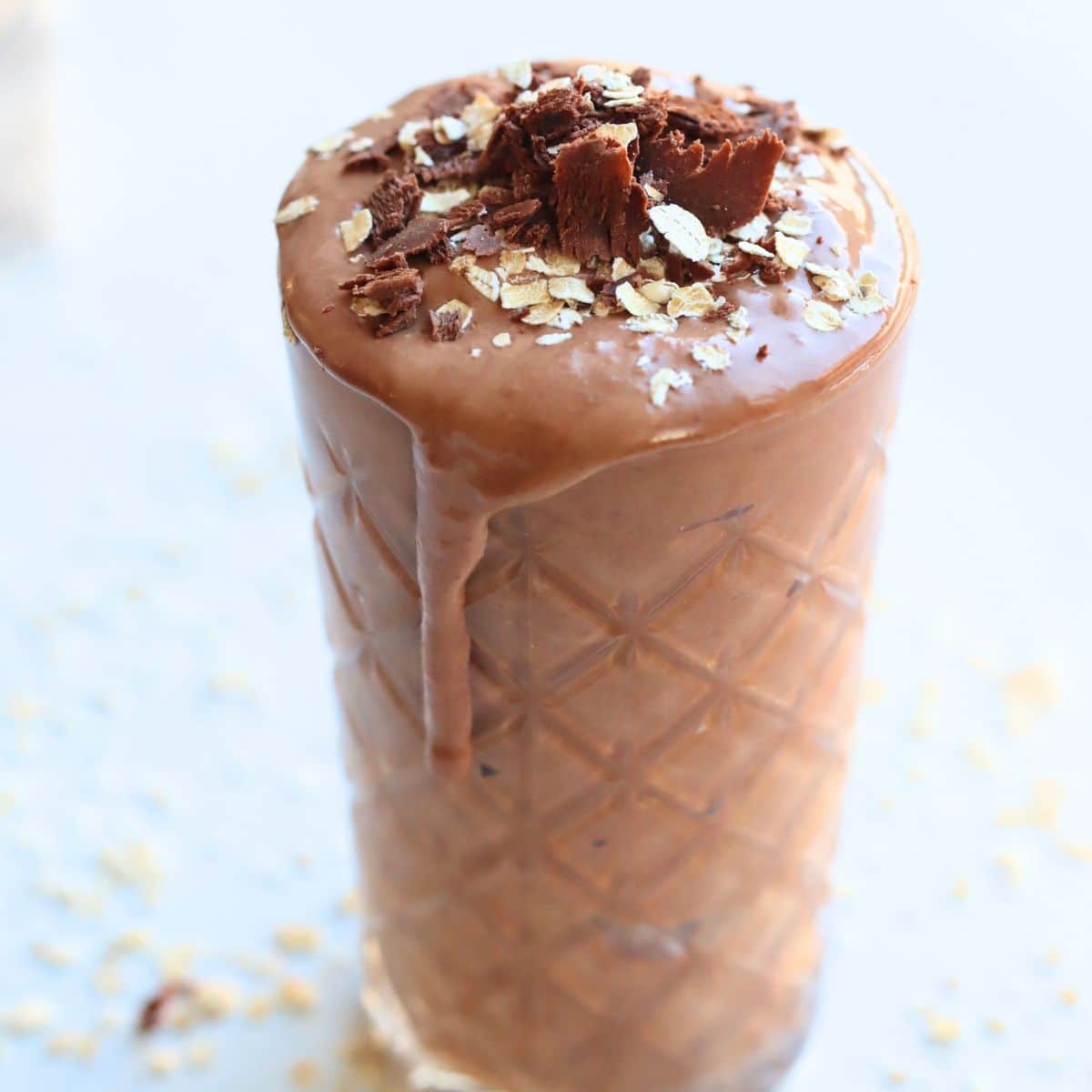healthy Wendy's chocolate frosty in a glass cup on a white background