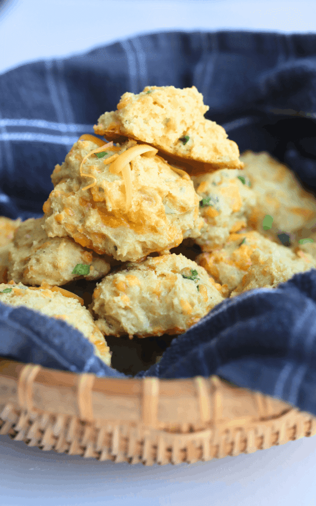 basket of homemade biscuits with cheddar and chives
